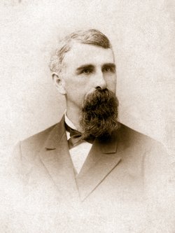 A formal portrait of a middle-aged man with a long pointed beard, in a dark jacket and bow tie.